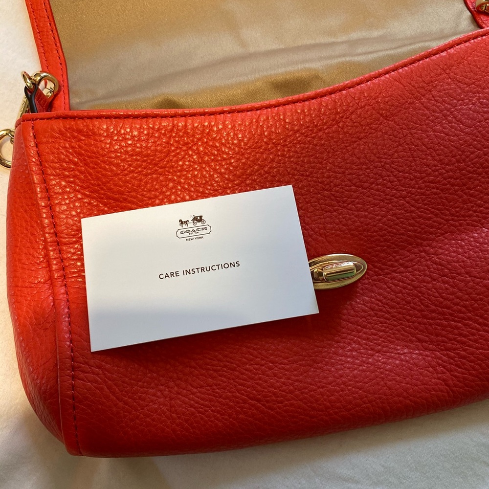 COACH crossbody clutch with gold chain strap